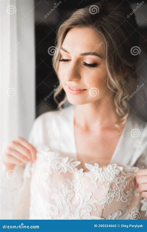 Luxury Bride In White Dress Posing While Preparing For The Wedding