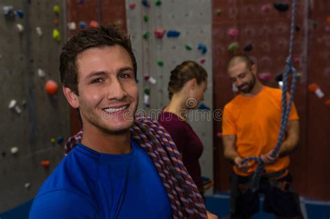 Portrait Of Man Carrying Climbing Rope In Gym Stock Photo Image Of