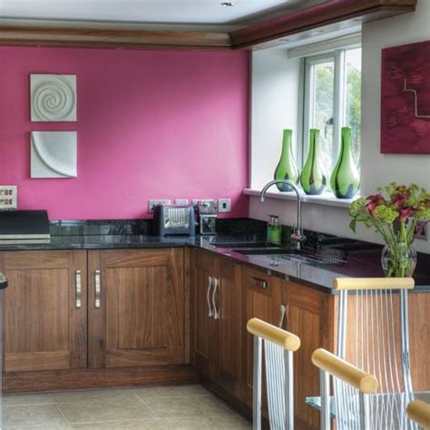 Im installing new kitchen cabinets in our open plan house. Love the colours in this kitchen...raspberry paint, walnut ...