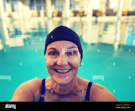 Portrait Of A Smiling Women In Swimming Pool Stock Photo Alamy