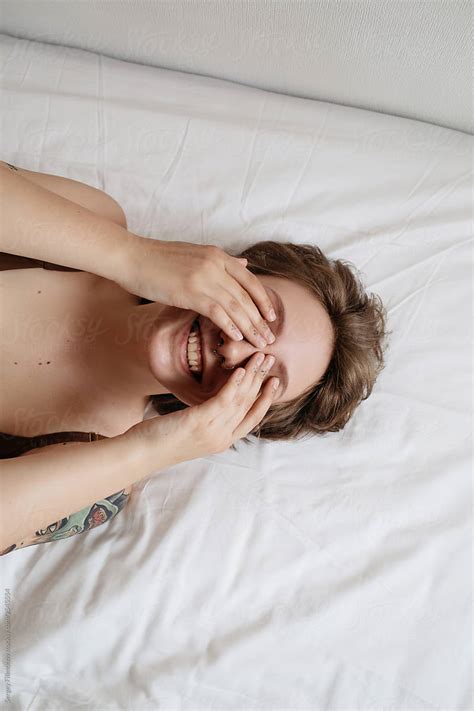 Happy Woman At Morning Lying On Bed Del Colaborador De Stocksy Sergey Filimonov Stocksy