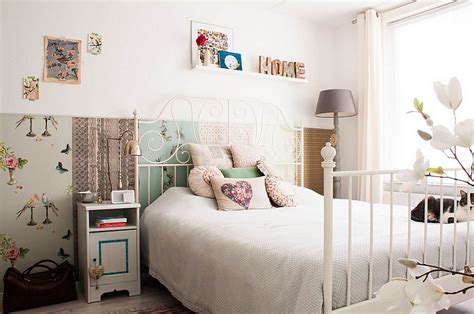 This primary bedroom features a wooden bed graced with intricate detailing. Feminine Bedroom Ideas, Decor And Design Inspirations