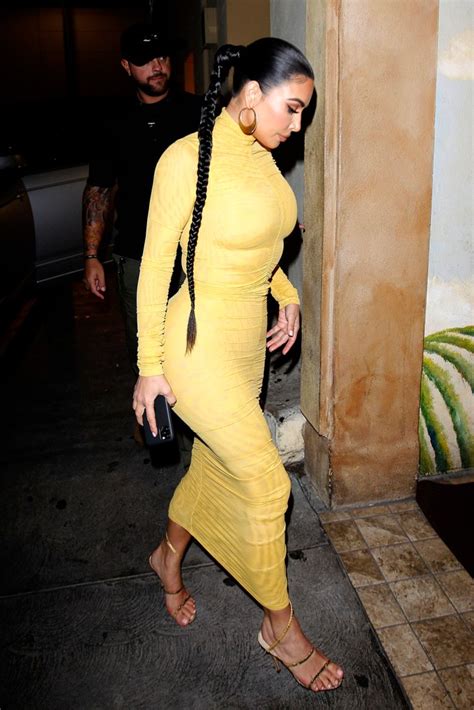kim kardashian rocks the hottest color in a body hugging dress and strappy sandals on la