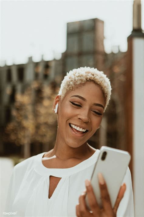 Happy Black Woman On Her Phone Premium Image By