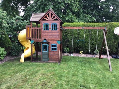 Childrens Wooden Playhouse With Slide Swings And Rings In Congleton