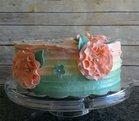 It's so exciting to see what they look like after. Coral And Teal Cake - CakeCentral.com