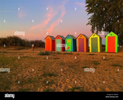 Brightly Coloured Beach Huts Stock Photo Alamy