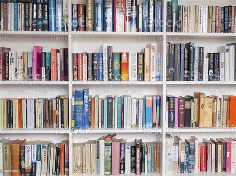 Welcome to your friendly neighborhood library. Books On A Book Shelf Stock Photo - Download Image Now ...