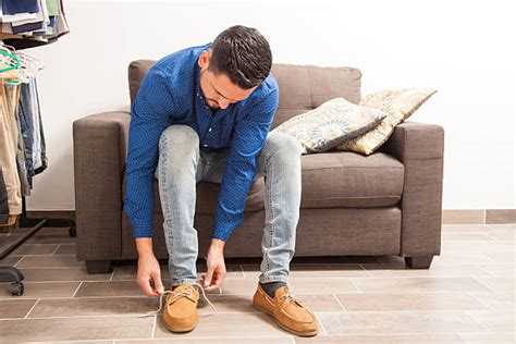 Man Putting On Shoe Stock Photos Pictures And Royalty Free Images Istock