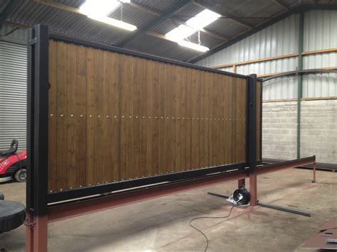 Sliding metal gates with wood infill. SLIDING GATES | AutoGates UK