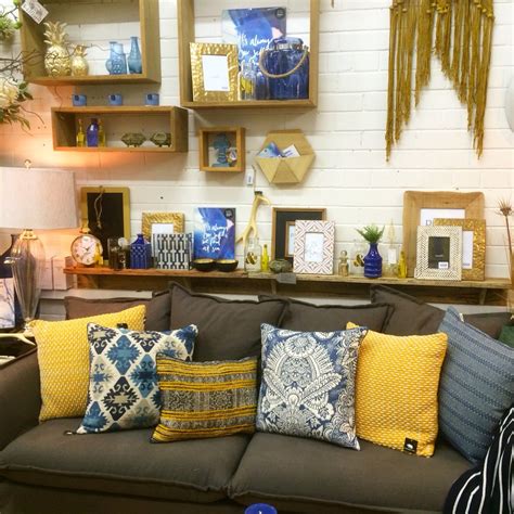 Find new and preloved home decor items at up to 70% off retail prices. Mustard and indigo shop display. Home decor and interiors ...