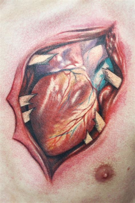 Amazing Ripped Heart Tattoo On Chest Tattooimages Biz