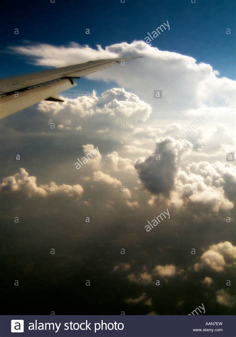 Aircraft Wing Flying Over A Cloudy Sky Stock Photo Alamy