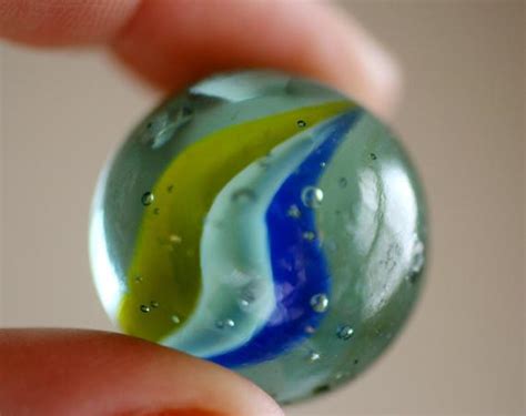 We recommend this bag of 1,000 (we did the math, that's only 2.4 cents per marble) glass cat's eye marbles in a rainbow of colors. Set of 4 VINTAGE Marbles Cats Eye Shooter Marbles Imperial