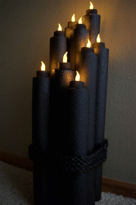 Halloween pumpkin archway, electrical conduit, pool noodles, spray foam, car. Recycled Pool Noodle Halloween Flameless Candle Decor