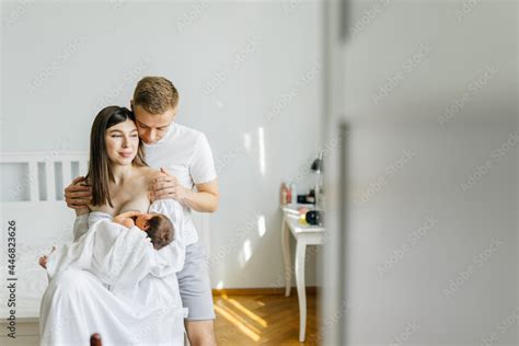 Love Couple Sitting In Cozy Bedroom Husband Hug Wife Woman