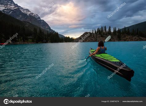 Adventurous Woman Kayaking Moraine Lake Striking Cloudy Sunset Taken