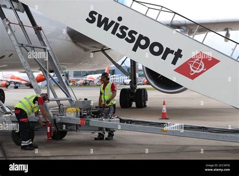 Swissport Ground Staff Service An Mng Airlines Jet At Luton Airport