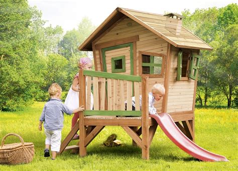 Kinder wünschen sich oft ein eigenes kinderspielhaus zum toben, spielen und erleben im hauseigenen garten. Axi Spielhaus Robin auf Stelzen mit Rutsche, Holz | Kinder ...