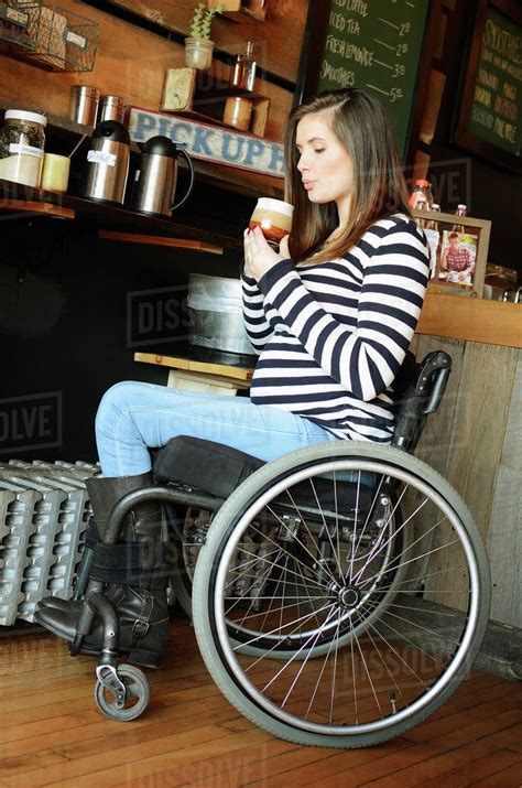 Paraplegic Woman In Wheelchair Drinking Coffee Stock Photo Dissolve