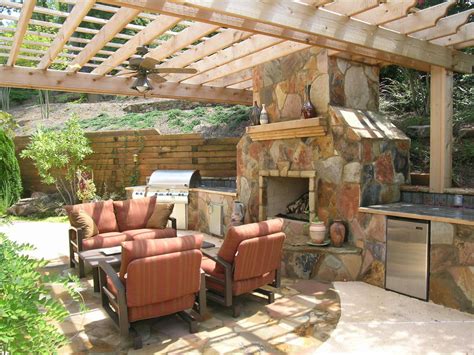 Fireplace With Pergola And Outdoor Kitchen Tropical Patio Atlanta