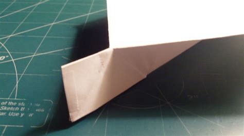 How do you make a boomerang paper airplane? How To Make The Harrier Paper Airplane - 6