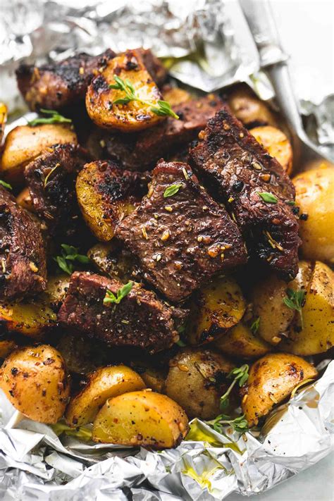Although you don't have to cook the outside of the pork tenderloin before tossing it in the oven, it will develop a deeper flavor and a golden yes, you may cover it with tin foil to keep it moist. Garlic Steak and Potato Foil Packs | lecremedelacrumb.com | Food recipes, Foil pack meals, Beef ...