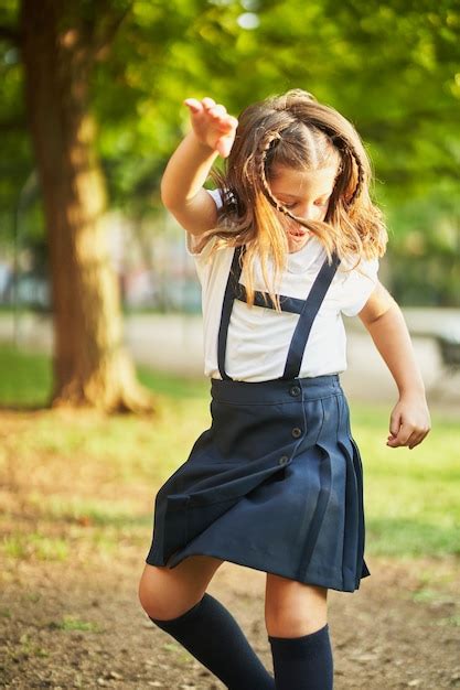 Premium Photo Little Spanish School Girl Dancing In Park