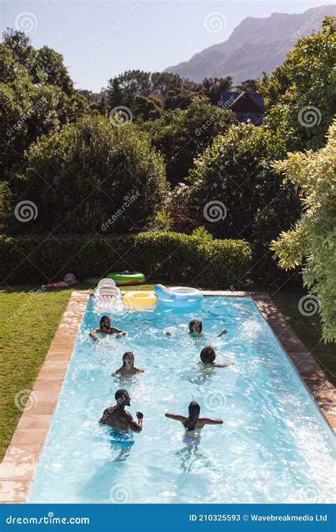 Diverse Group Of Friends Having Fun In Swimming Pool Stock Image