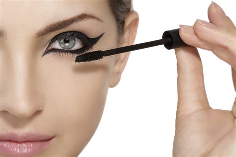 Beautiful Model Applying Mascara On Eyelashes Close Up