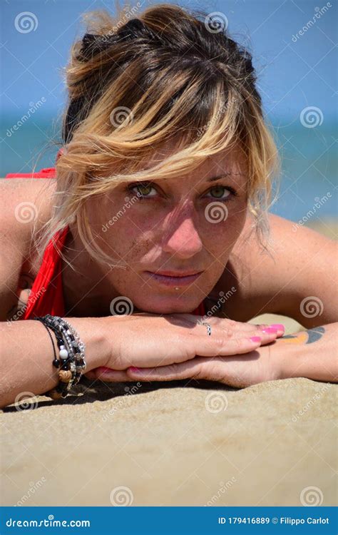 Rebel Blonde Girl Poses Lying In Swimsuit Stock Image Image Of Blond Legs 179416889