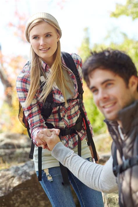 Man Helping His Girlfriend Hiking Stock Photos Free And Royalty Free