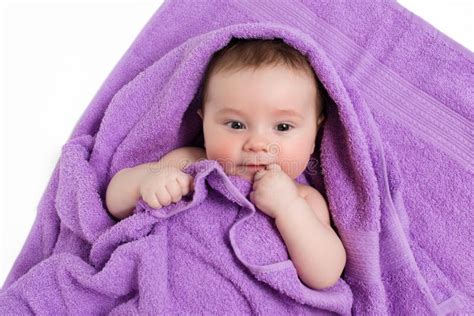 Newborn Baby Lying Down And Smiling In A Purple Towel Stock Photo Image Of Care Clean
