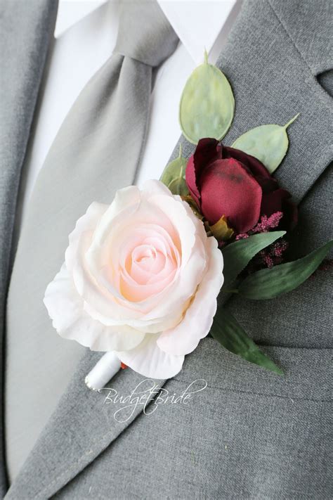 Wedding flower arrangements go beyond the basic centerpieces and bouquets. Davids Bridal Burgundy Wine and blush pink Wedding Flower ...