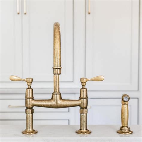 Augusta long legs kitchen faucet with brass cross handles. Update your kitchen with these 15 sleek sink and faucet ...