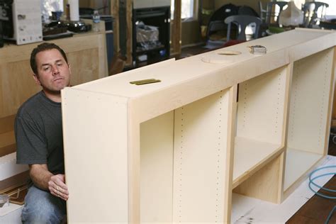 The top and bottom, along with a pair of cleats for mounting the cabinet, are captured between the sides and located with biscuits. Particle Board vs. Plywood Cabinets for Kitchens and Bathrooms