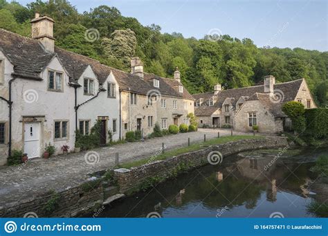 Street View Of Old Riverside Cottages In The Picturesque Castle Combe