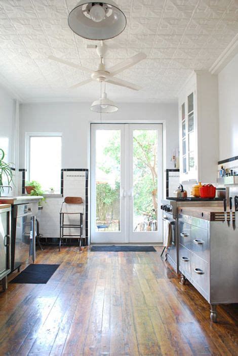 Contemporary white kitchen with wood panel ceiling accent. 10 Cheap Remodeling Ideas That Look Anything But (With ...