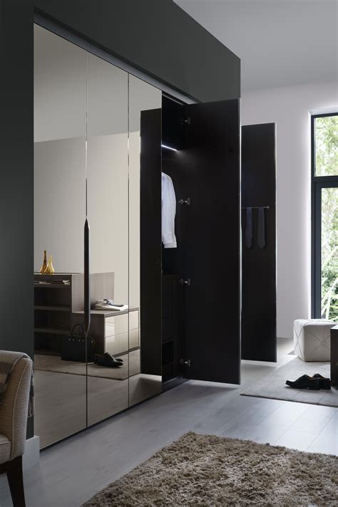 Conventional hinged wardrobes or with contemporary sliding doors, mirrors add functionality to wardrobe design. Frameless Bronze Mirror Hinged Wardrobe | Mirrored ...