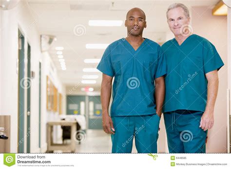 Two Orderlies Standing In A Hospital Corridor Stock Image Image Of