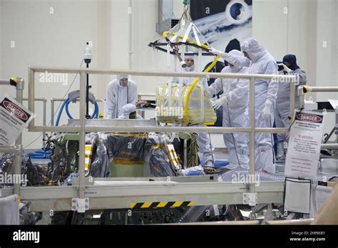 A Crane Lowers The Main Parachute For Installation On The Orion