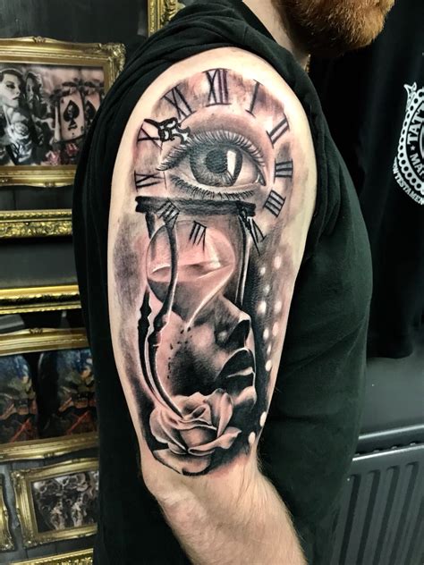 Clock and eye tattoo by Ash Availability at Holy Grail Tattoo Studio