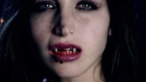 Female Vampire Looking Camera With Fangs And Blood Slow Motion Stock