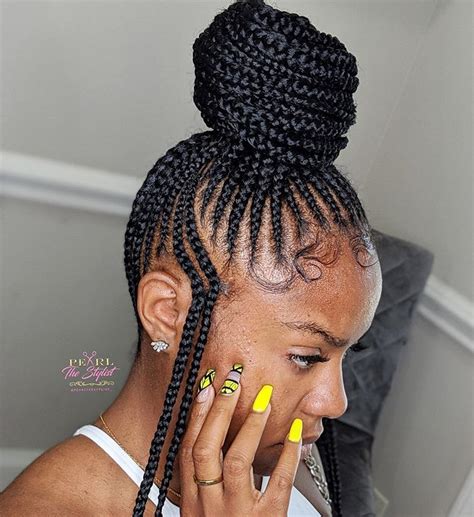 Secure the remaining hair into a mini ponytail, then twist all the loose hair into two buns. MASTER BRAIDER on Instagram: "The small feed-in bun ...