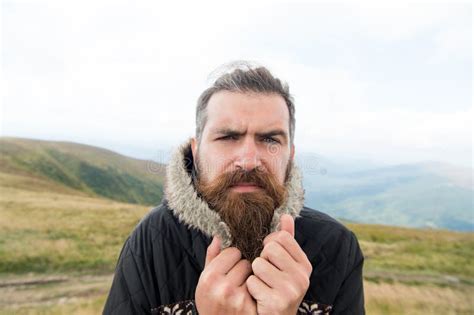 Bearded Man Brutal Caucasian Hipster With Moustache Cold On Mountain