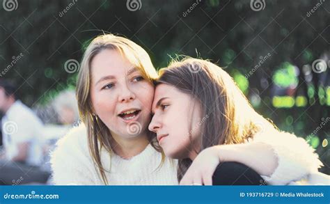 Lesbian Couple Relax In Park In Sunny Day Media Stock Image Image Of