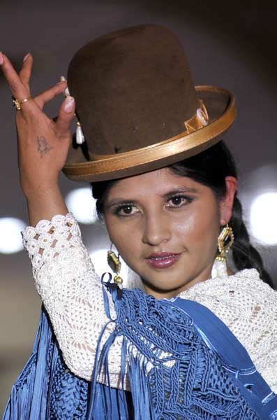 Plenty of women's clothing to choose from. An indigenous Bolivian Aymara woman takes part in a ...