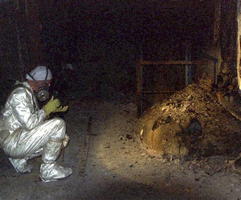 The elephant's foot of the chernobyl disaster, 1986 : Check out how they're moving (moved?) the giant container ...