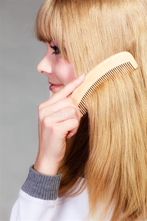 Closeup Girl Combing Her Long Hair Stock Photo Image Of Blond