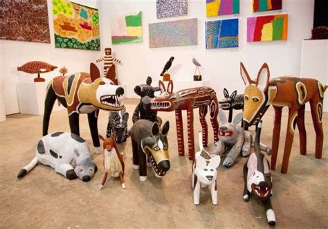 Several Different Animal Sculptures On Display In A Room